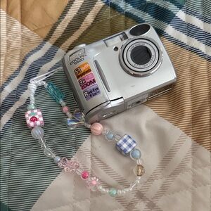 Silver Nikon digital camera [WORKS]